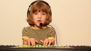 Stock-footage-little-girl-play-music-on-keyboard